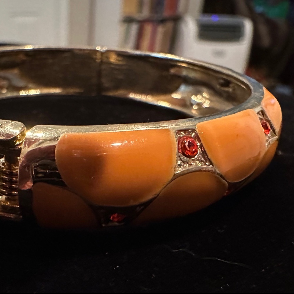 Peach colored hinged bangle
